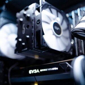 Home Detailed view of a cooling fan inside a modern gaming PC setup.